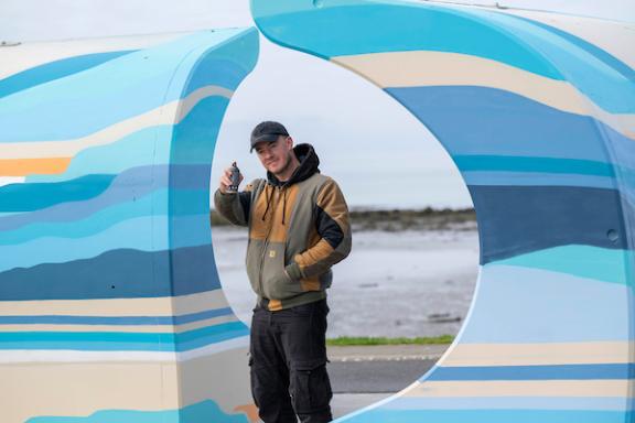 Local artists with the murals he painted