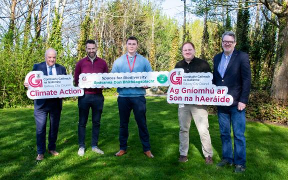 GCC Staff holding climate action signs