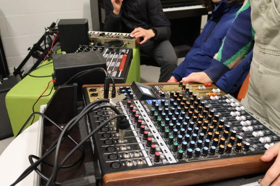 People playing with audio mixer