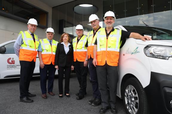 staff standing with van with Live for Lorcan logo
