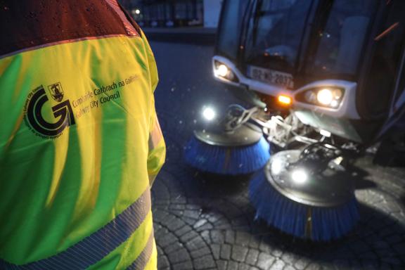 gcc jacket with sweeper in background