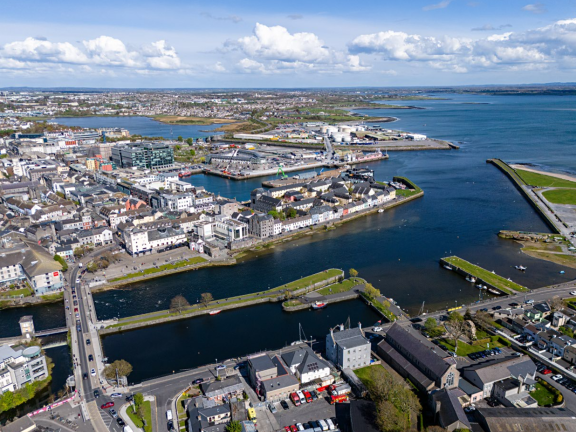 Aerial of the city looking at the Claddagh in the foreground and the docks in the background