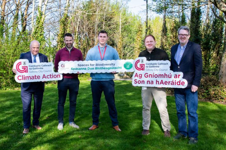 GCC Staff holding climate action signs