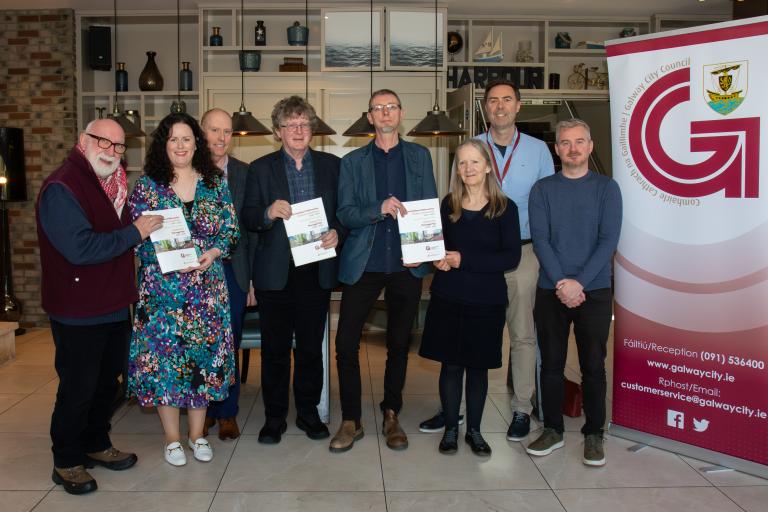 Members of Galway Heritage Forum standing with Heritage Plan