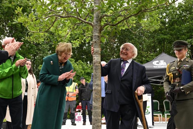 President Higgins after planting a new tree, with Sabina Higgins also pictured