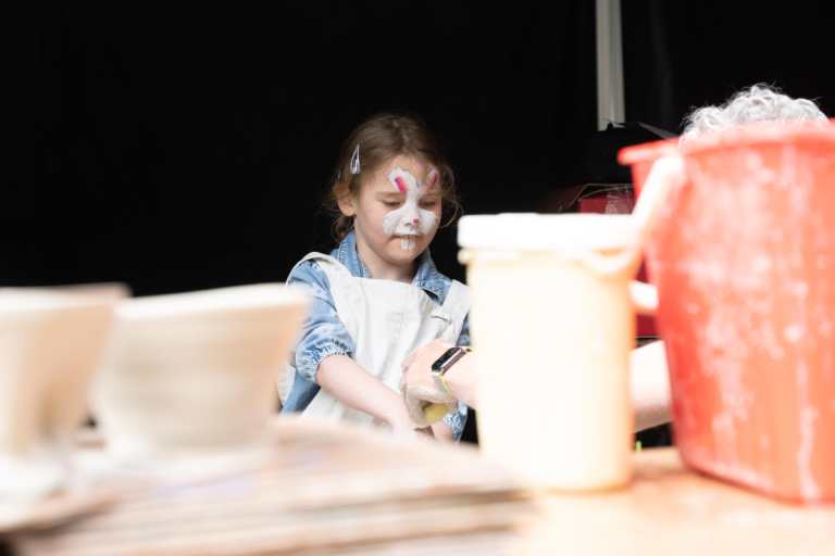 child with bunny face paint