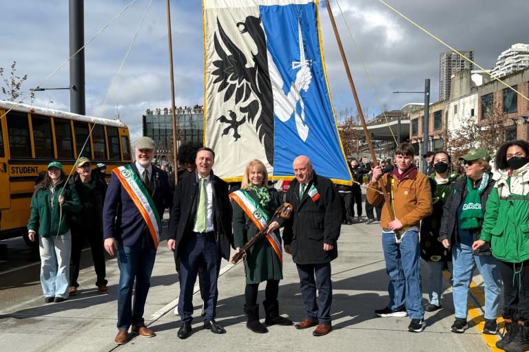 Officials in Seattle with Connacht flag behind them
