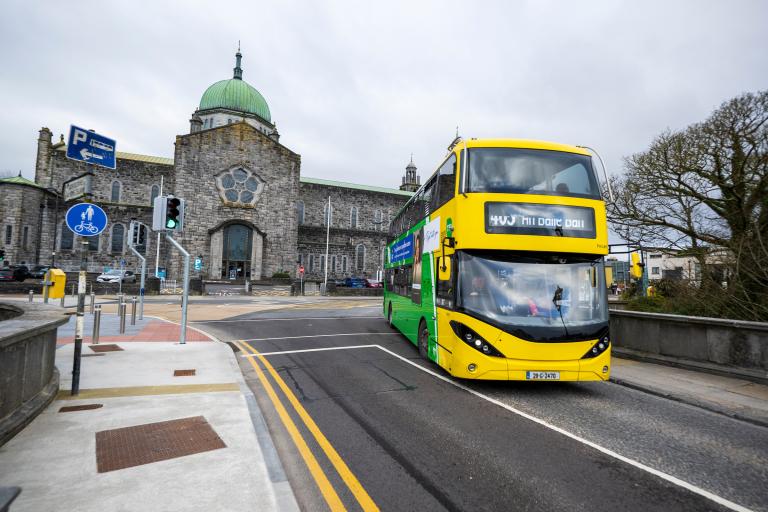 An image of a Galway City Bus passing in front of Galway Cathedral