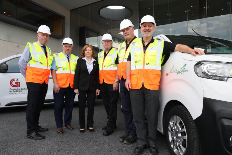 staff standing with van with Live for Lorcan logo