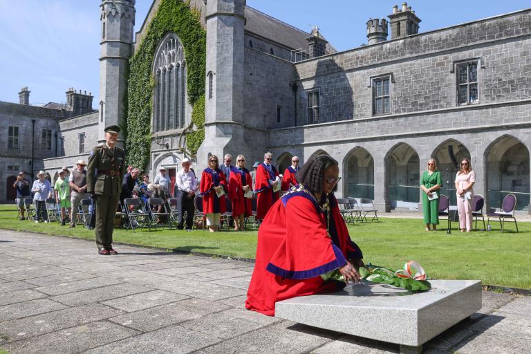 The mayor placing a wreath at the commemorative plaque