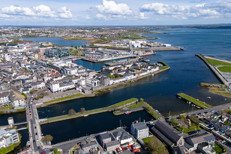 Aerial of the city looking at the Claddagh in the foreground and the docks in the background