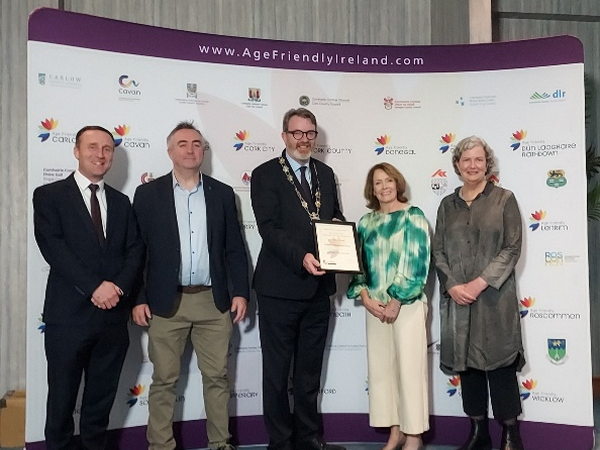 Members of staff and the design team on An Cliathan with their shortlist cert at the Age Friendly Awards 2024