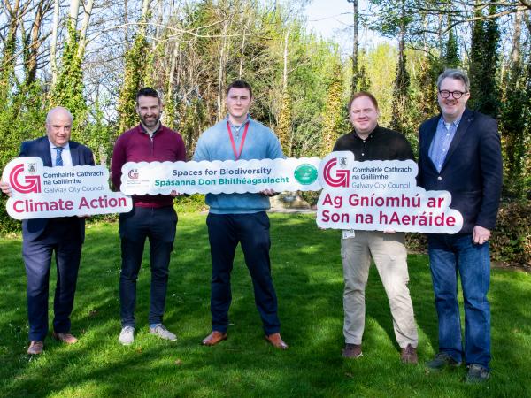 GCC Staff holding climate action signs