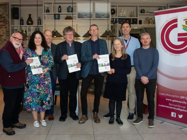 Members of Galway Heritage Forum standing with Heritage Plan