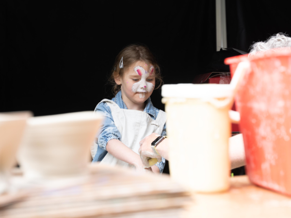 child with bunny face paint