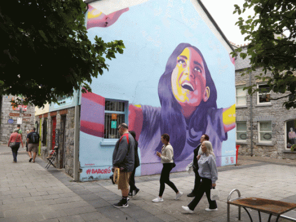 Street view in Galway City showing wall mural at gable end of building