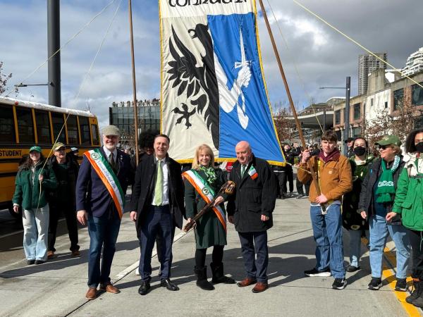 Officials in Seattle with Connacht flag behind them