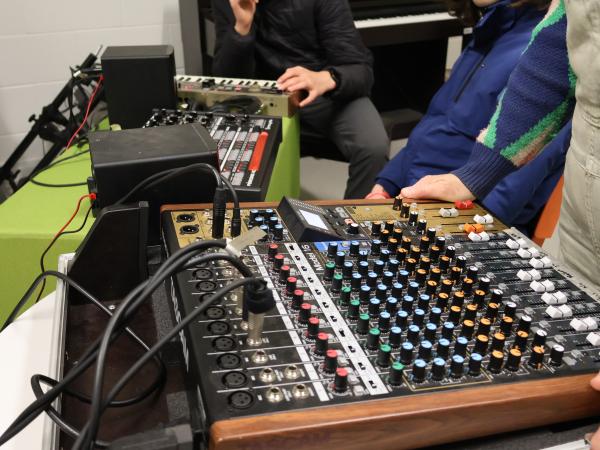 People playing with audio mixer
