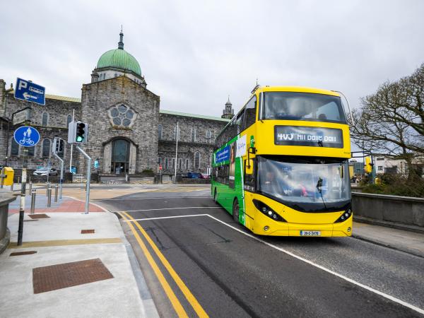 An image of a Galway City Bus passing in front of Galway Cathedral