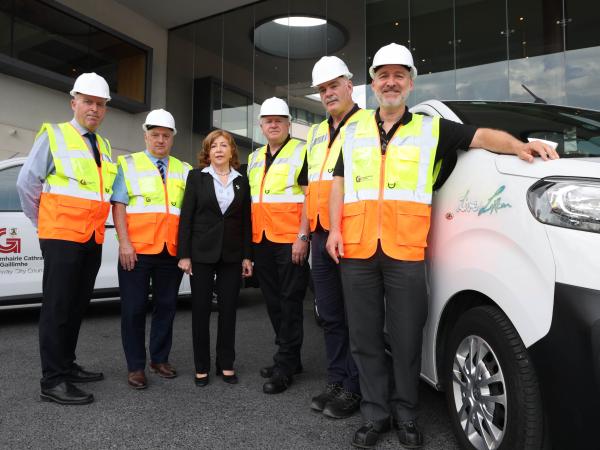 staff standing with van with Live for Lorcan logo